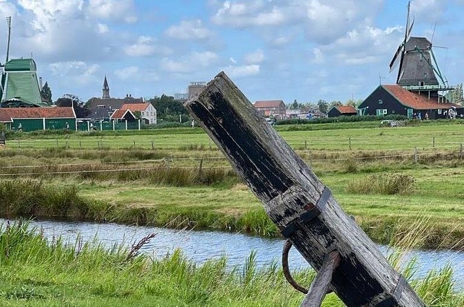 The arm of a windmill sail crossing the polder ditches at the Zaanse Schans