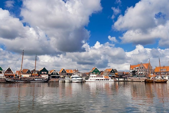 The wooden houses and moored boats along the harbour front at Volendam